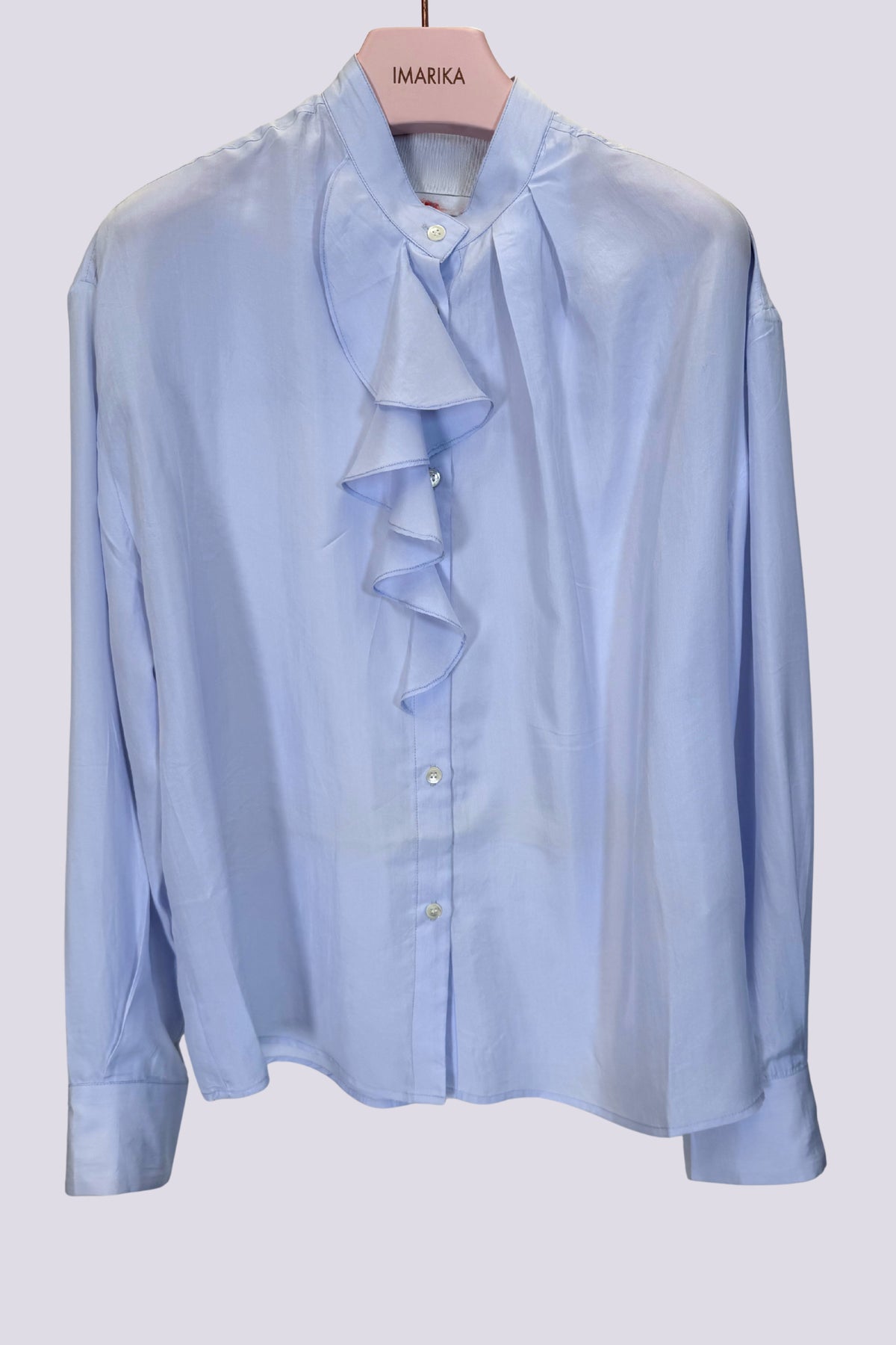 Camicia azzurra con volant
