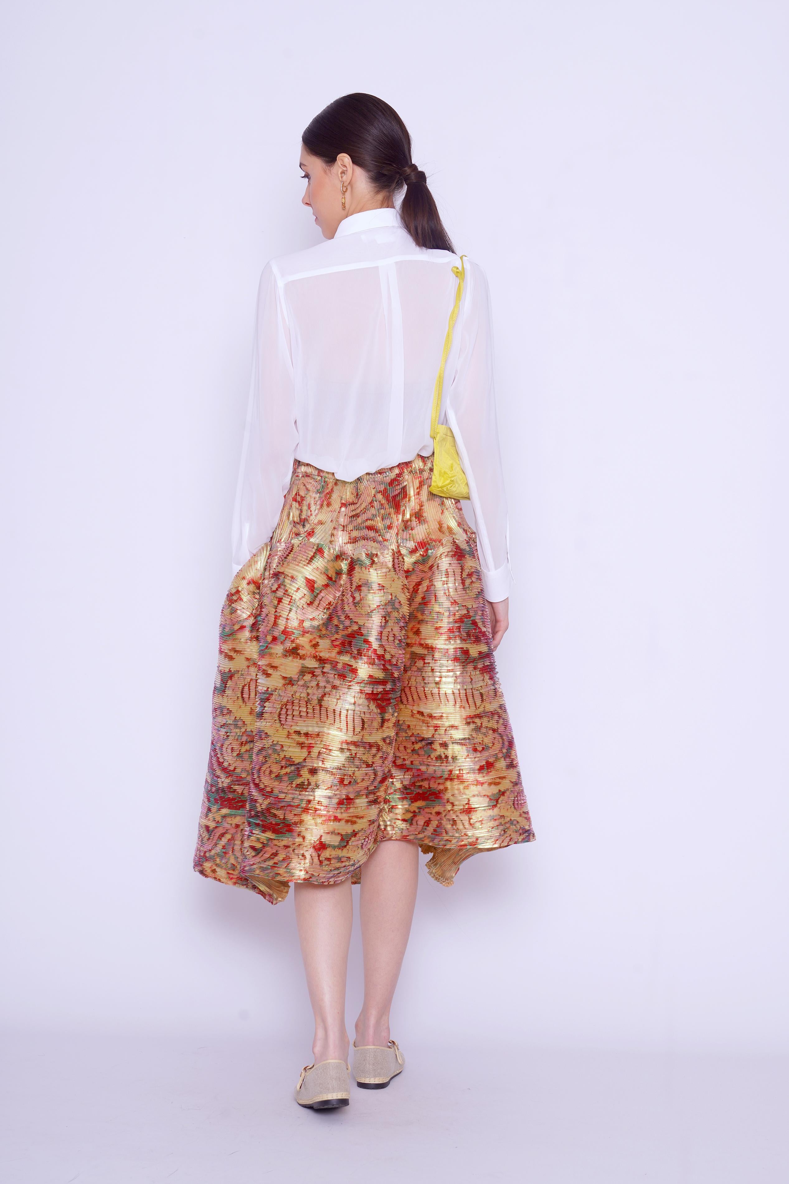 Gonna a ruota plissettata