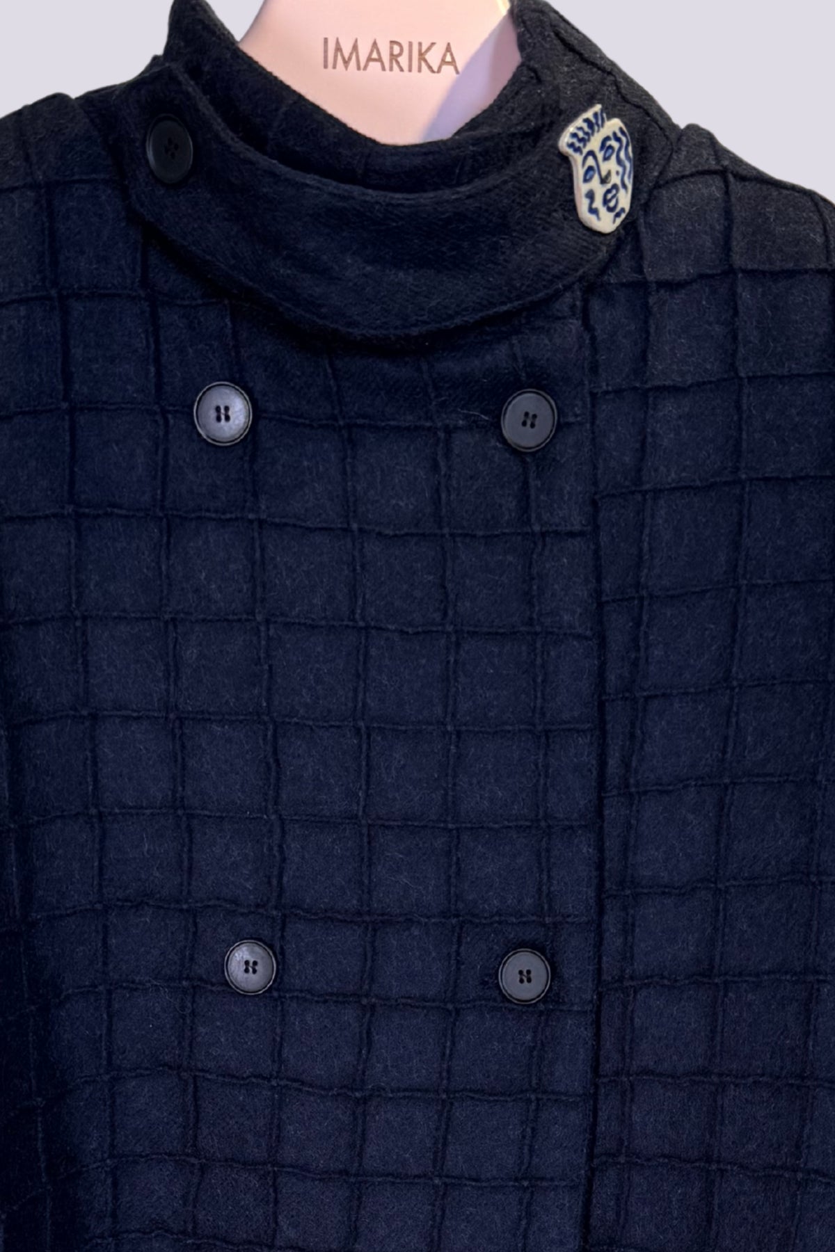Cappa con texture a quadri 