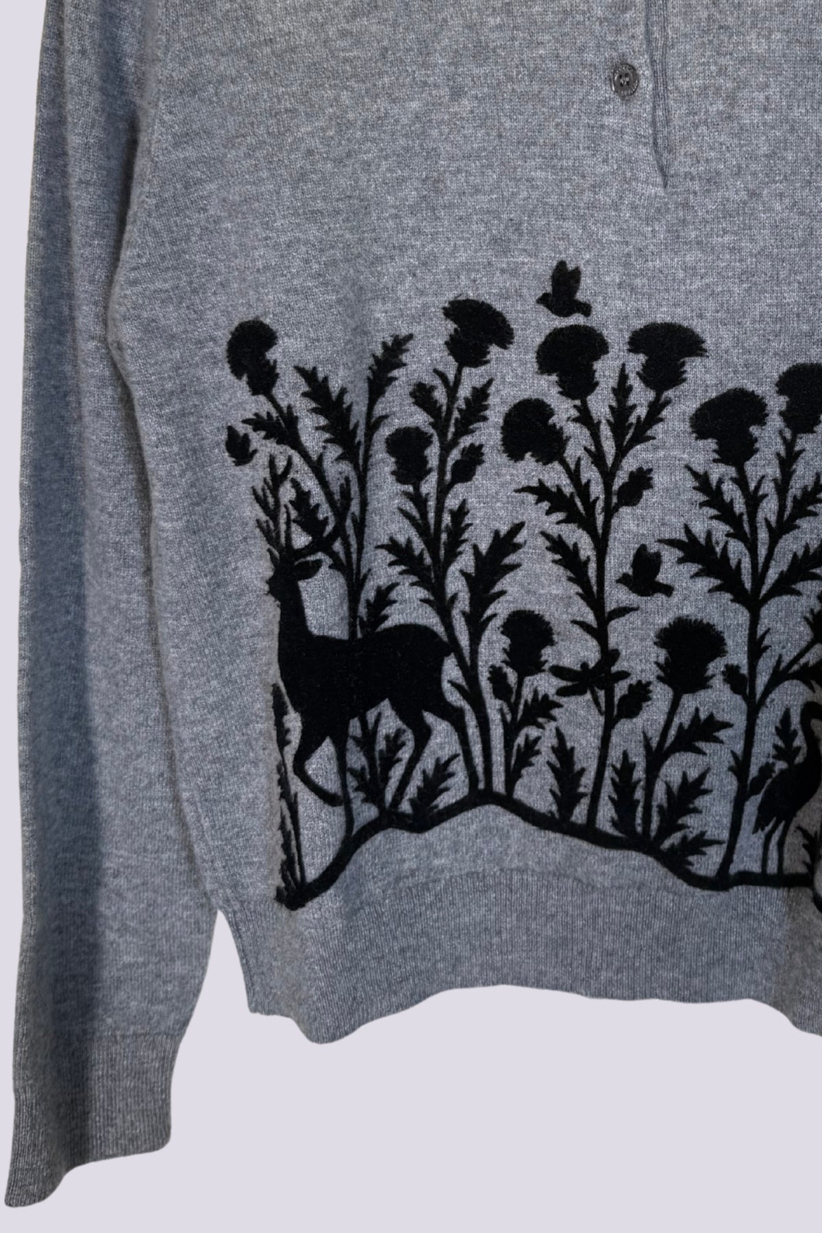 Polo grigia con decorazione floccata 